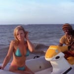 Julie and Winston escape on the boat